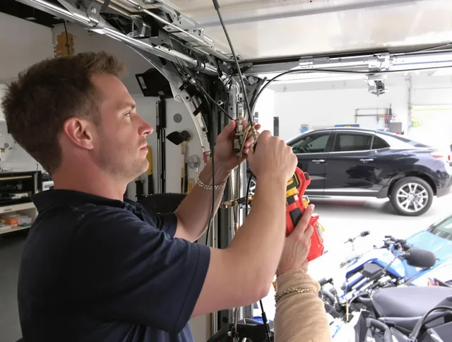 Belmont Garage Door Repair safety certified technician performing cable replacement in Belmont