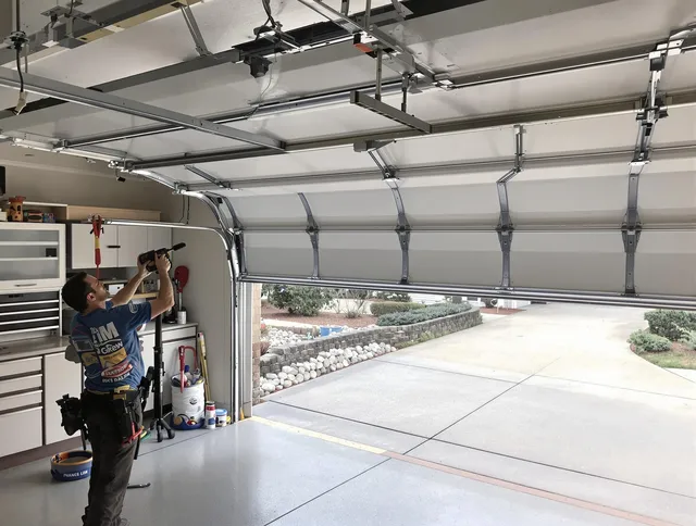 Garage door track repair service by Belmont Garage Door Repair in Belmont